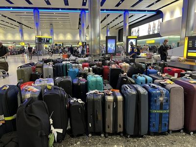 Woman spends three hours wading through luggage at Heathrow after being left without clothes for a week