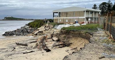 Security fences line Stockton beach as erosion bites