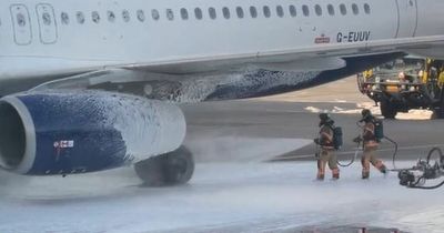 Firefighters tackle blaze on British Airways passenger plane