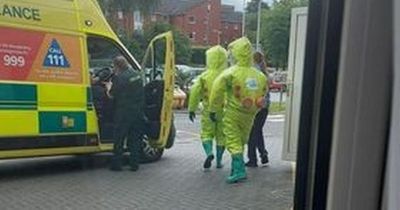 'Don't panic', say bosses at Royal Oldham Hospital after concerned patients spot medics in Hazmat suits