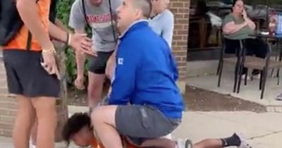 Off-duty officer sparks outrage after pinning black teenager to pavement with his knee