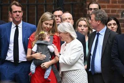 Boris Johnson’s wife Carrie supports him with baby daughter Romy as he resigns