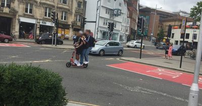 Investigation as THREE ride on e-scooter in Bristol city centre