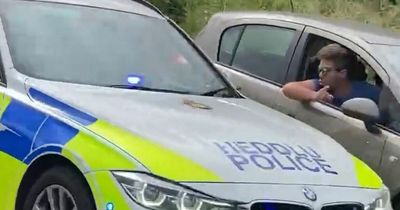 Driver filmed appearing to undertake M4 'go-slow' protesters on hard shoulder - until police spot him