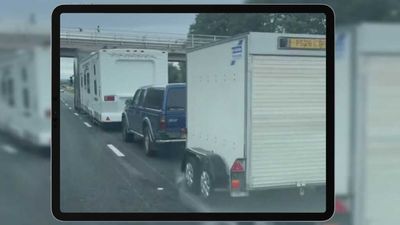 Truck Towing Two Trailers And An SUV Is A Sketchy Road Trip