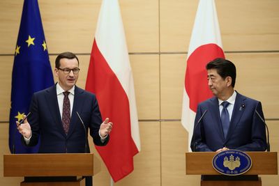 Polish PM Morawiecki 'deeply shocked' by Abe killing