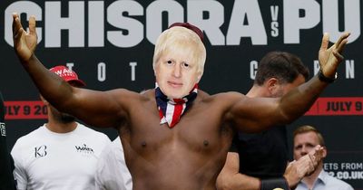 Derek Chisora weighs in wearing Boris Johnson mask in support of PM