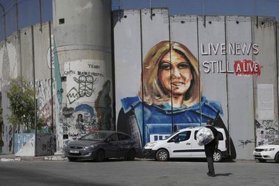 Family of journalist killed in West Bank lashes out at Biden