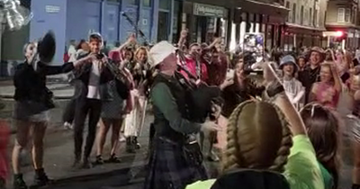 Bagpiper in bucket hat delights TRNSMT revellers on way home with Flower of Scotland rendition