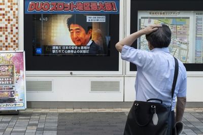 Japan mourns as body of assassinated PM Abe returns to Tokyo