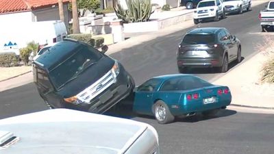 Watch Oblivious SUV Driver Hit And Literally Drive Over C4 Corvette