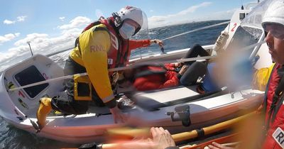 Lifeboat crews rescue 'unconscious' man from rowing boat near Scots harbour