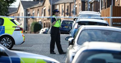 Armed cops storm street following reports of gunman opening fire