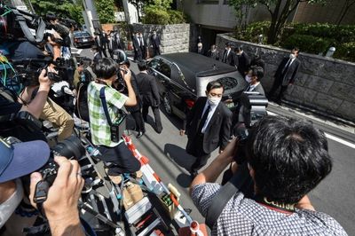 Japan police admit security flaws as body of assassinated ex-PM Abe arrives home