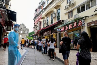 Macau shuts casinos and other businesses to contain COVID outbreak