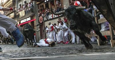 Seven hurt as raging bull narrowly misses thousands of spectators at controversial festival