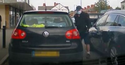 Man seen climbing head-first into car after breaking in