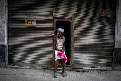 A year after protests, Cuba struggles to emerge from crisis