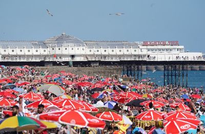 In Pictures: Britons head to coast to cool off as temperatures soar