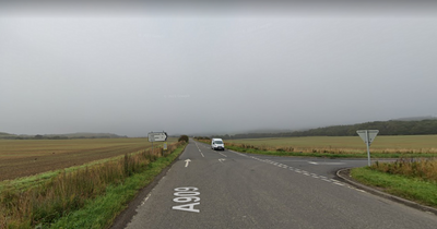 Police race to the scene of a two-vehicle crash on Fife road