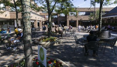 Highland Park’s Central Avenue reopens with busy shops, bustling traffic and remembrances of a week ago