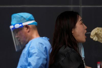 Shanghai plans more COVID testing amid fresh curbs across China