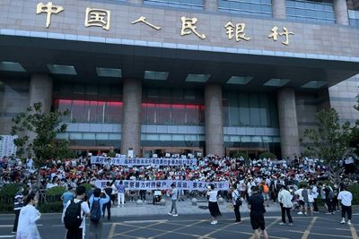 China detains alleged bank fraud 'gang' after rare mass protests