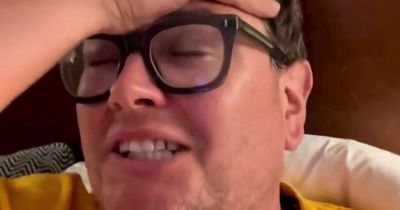 Alan Carr reassures fans after falling to floor in agony on stage during comedy tour