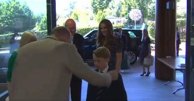 Cute moment Prince George hugs dad William and says he's too hot in his suit and tie