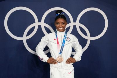 ‘No, I’m good, I’m 25’: Simone Biles offered colouring book on flight home from Washington