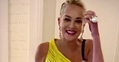 Age-defying Sharon Stone, 64, turns heads in figure-hugging lemon jumpsuit in Italy