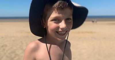 Boy, 11, scarred by 'red hot' sand from disposable barbecue bravely walks on beach again