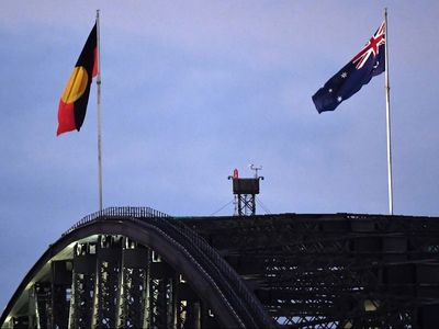 Aboriginal flag raised in new permanent position atop Sydney Harbour Bridge