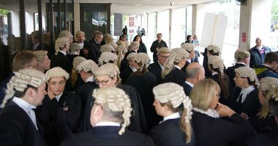 Barristers slam 'crumbling' justice system as lawyers strike for third week