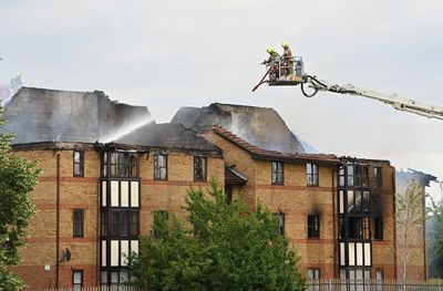 Woman who died after explosion at Bedford flats named by police