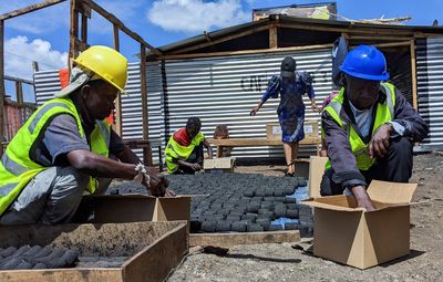 In Congo, elderly craft clean fuel pellets to keep active