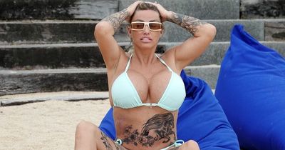 Katie Price shows off huge new horse stomach tattoo as she hits the beach in Thailand