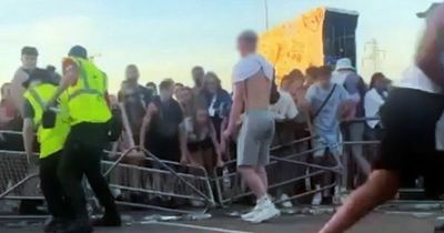 Woman hurt as crowd surged through barriers and past security at festival