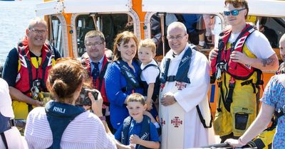 The heart-warming moment child is christened on Tynemouth lifeboat where dad is crewman