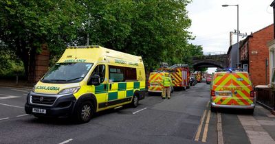 Four car crash closes busy road as police and ambulance attend