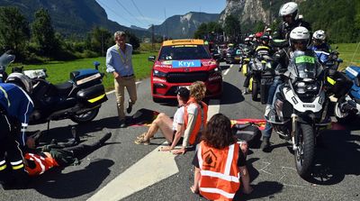 Protesters Block Road, Light Flares on Course at Tour de France