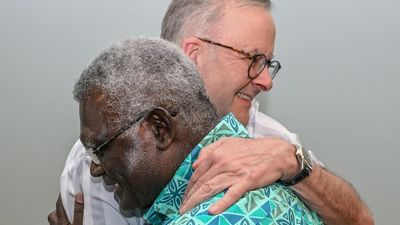 Anthony Albanese hugs Solomon Islands PM and preaches positivity at Pacific Islands Forum in Fiji