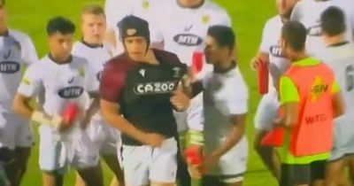 Young Wales player sparks fury by walking into South African team huddle and taking their water during showpiece clash