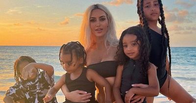 Kim Kardashian shares rare beach snap with all four of her kids as son Saint pulls funny face