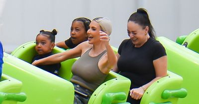 Kim Kardashian and North enjoy a rollercoaster ride as Chicago looks terrified