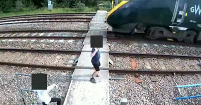 Terrifying CCTV shows kids playing in front of moving train