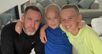 Stephen Bradley shaves his head in solidarity with his son as they fundraise for charity