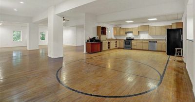 School gym transformed into house with 'basketball court kitchen' on sale for £250,000