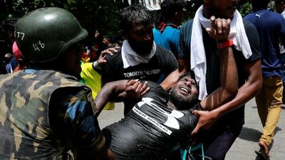 Sri Lanka's acting President, Ranil Wickremesinghe, tells military to do 'whatever is necessary' to restore order