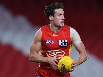 Suns' AFL lifer Swallow hailed by Dew